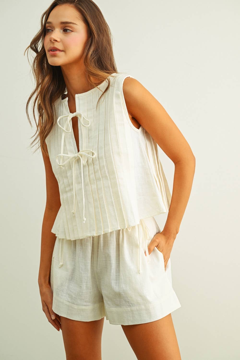 T6059ST   SLEEVELESS ALL PLEATED WITH TIE IN FRONT LINEN TOP