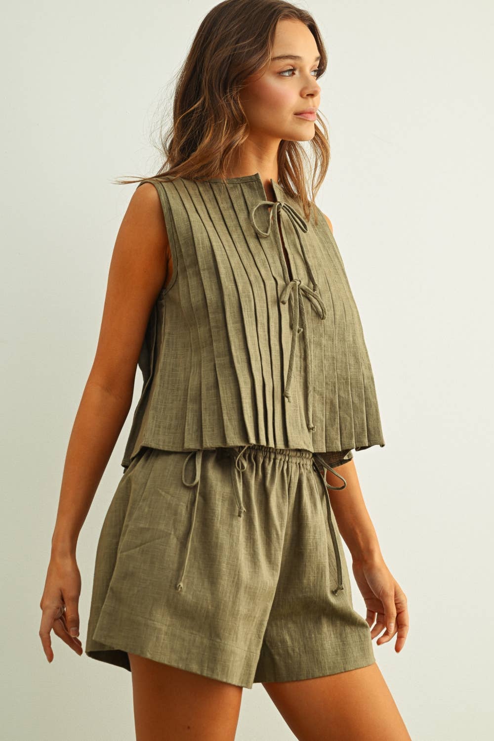 T6059ST   SLEEVELESS ALL PLEATED WITH TIE IN FRONT LINEN TOP