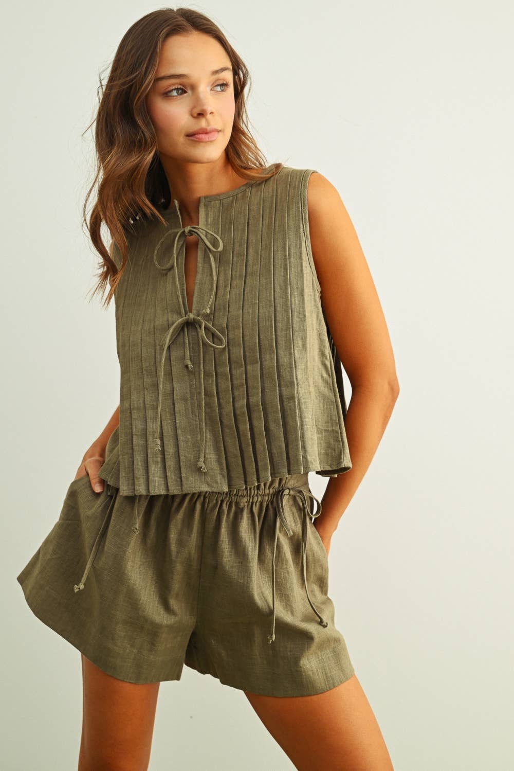 T6059ST   SLEEVELESS ALL PLEATED WITH TIE IN FRONT LINEN TOP