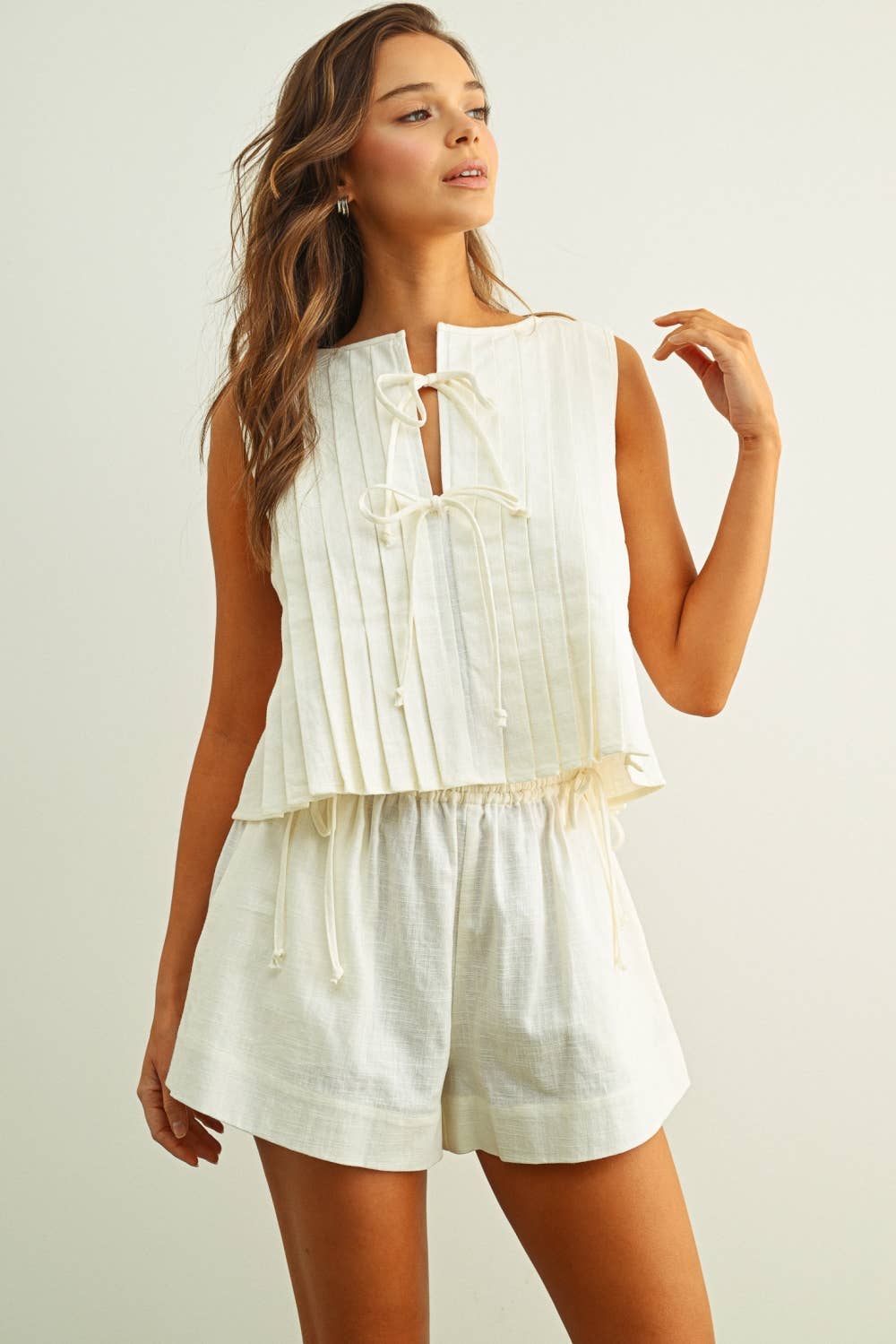 T6059ST   SLEEVELESS ALL PLEATED WITH TIE IN FRONT LINEN TOP